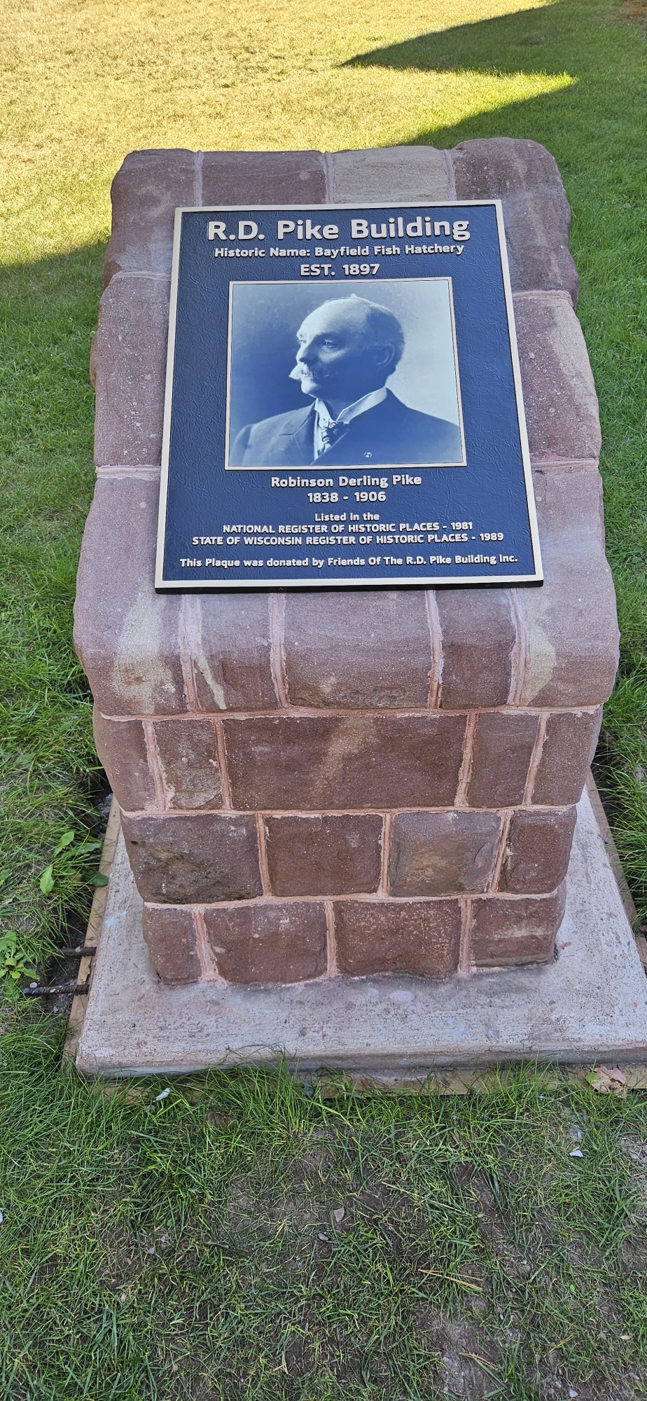 plaque dedicated to pike building